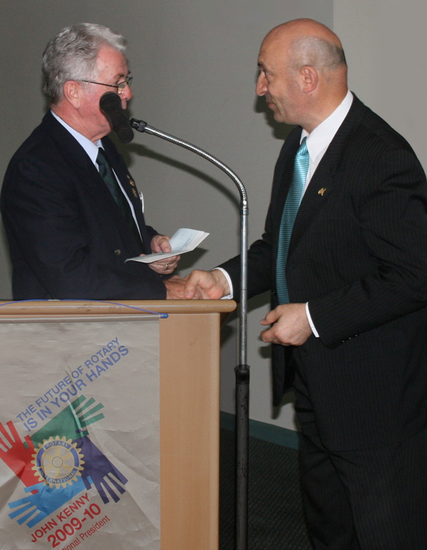 Niall King receives a cheque from Strathfield Mayor Councillor Tony Maroun
